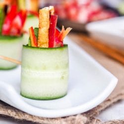Cucumber Appetizers are simply the best. These Vegan Asian Cucumber Rolls are the perfect refreshing bite of tangy Asian flavors of tofu, avocados, red pepper, and lightly pickled carrots & radishes. Gluten Free!