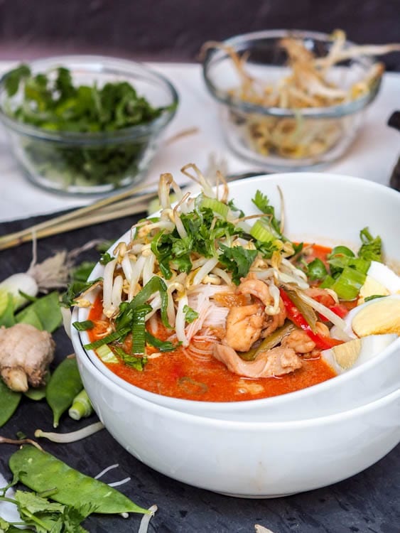 Laksa soup with chicken, shrimp, sugar snap peas, and red peppers