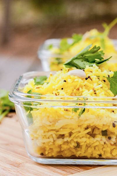 Lemon Rice makes for the perfect healthy side dish. With a flair of Indian flavors this lemon rice is made with turmeric, ginger, chili, lemon and Indian spices. Gluten Free and Vegan | avocadopesto.com