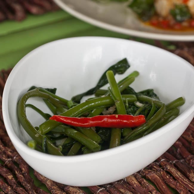 Thai Morning Glory Vegetable Stir Fry garnished with a chili pepper