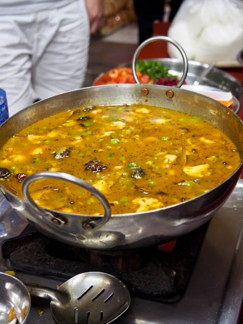 vegetable biryani simmering in water