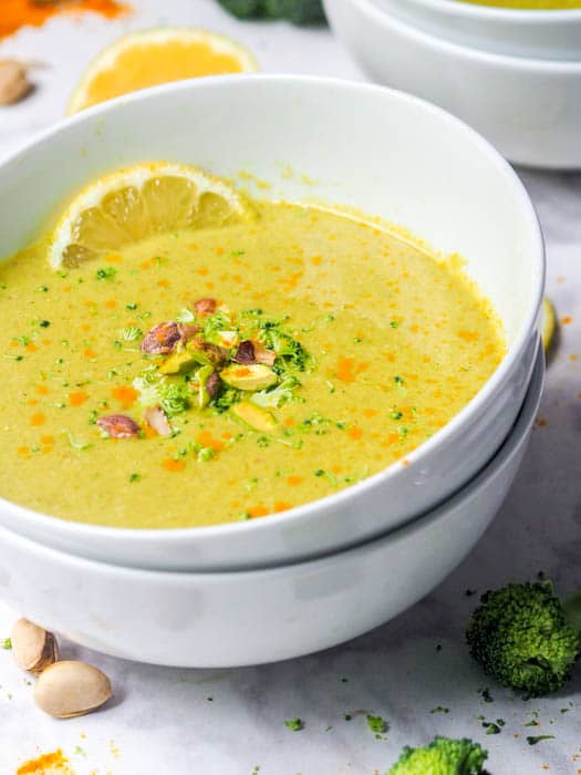 Vegan cream of broccoli soup garnished with chopped pistachios