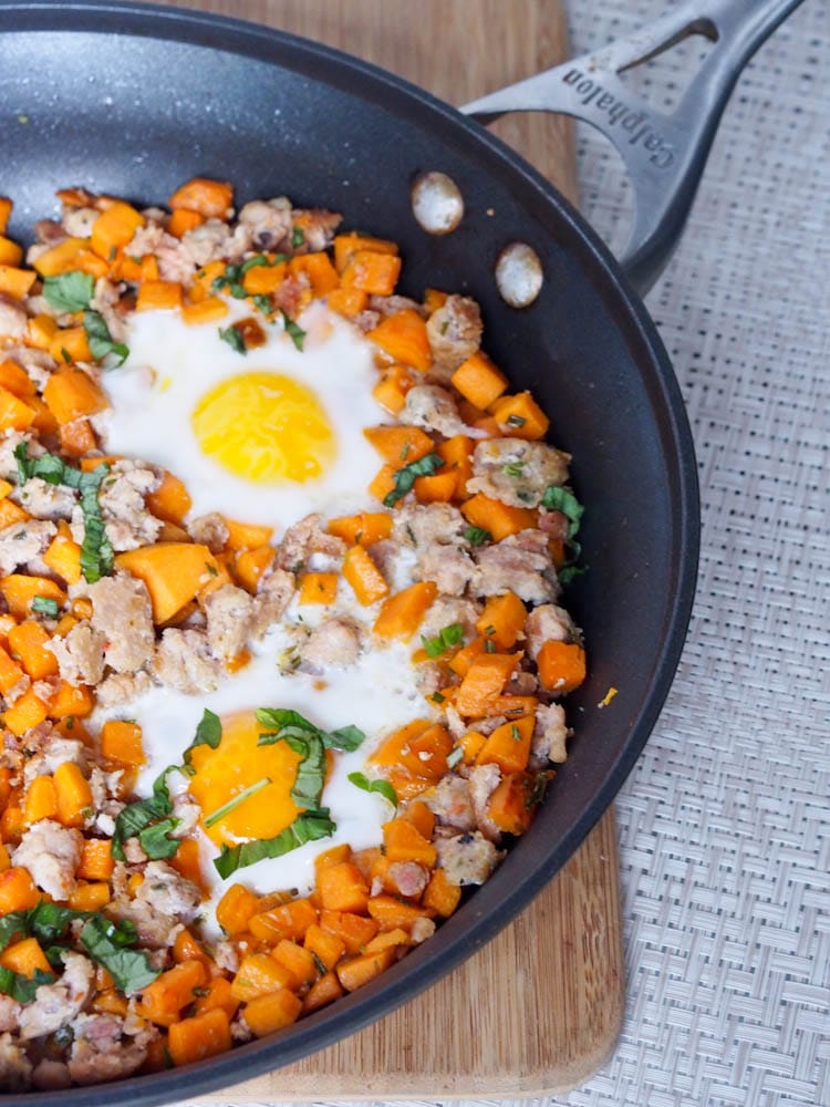 Chicken Sausage Sweet Potato Hash in the skillet garnished with basil