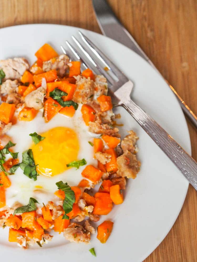 Chicken Sausage Sweet Potato Hash with eggs plated for breakfast
