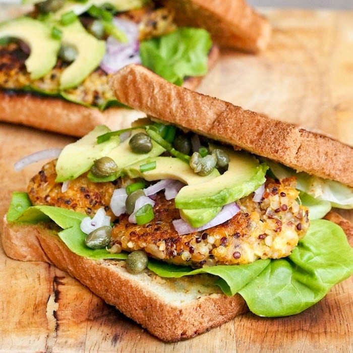 Vegan Sweet Potato Squash Burgers sandwiched between two slices of bread
