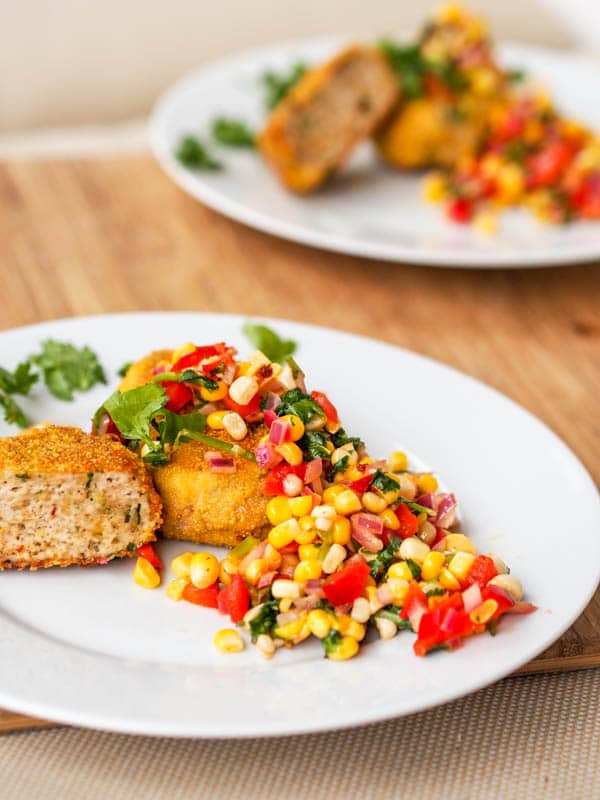 Healthy turkey patties served with a vegan corn salsa