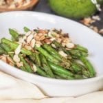 pesto coated green beans sprinkled with almonds
