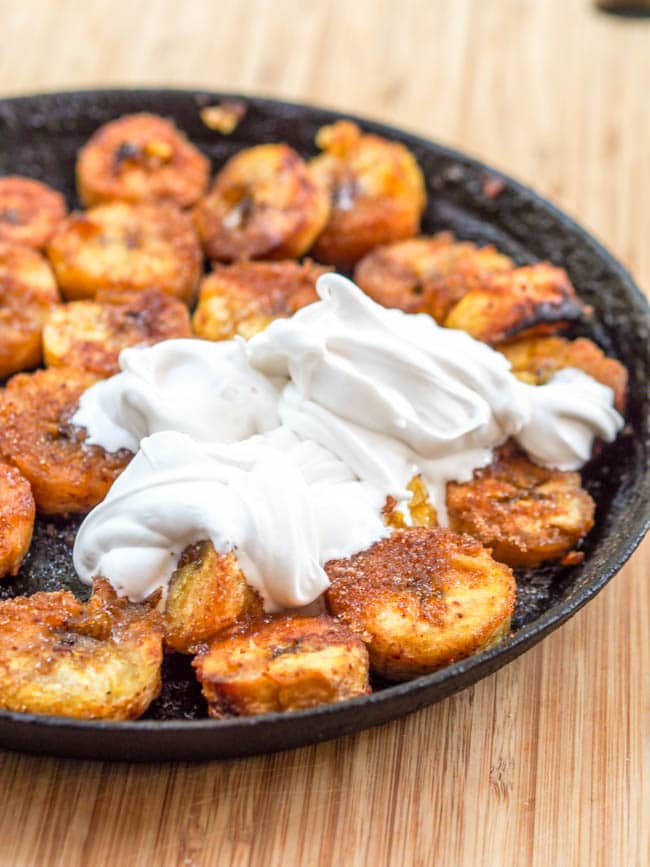 Caramelized Plantains topped with coconut whipped cream