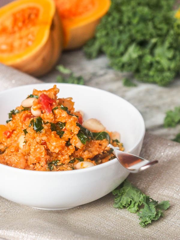 One pot 35 minute vegan butternut squash stew made with quinoa, tomatoes, white beans and kale