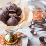 9 ingredient 100 calorie vegan hazelnut truffles with toasted coconut, figs, and walnuts, all pulsed together in the food processor before being dipped in melted dark chocolate.