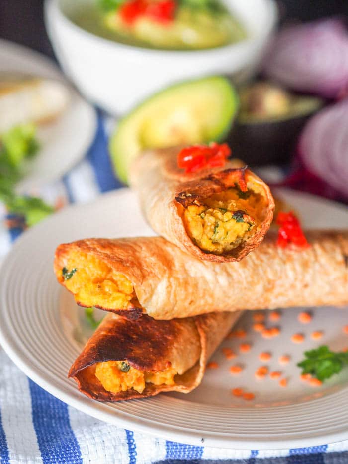 Vegan taquitos with red lentils, butternut squash, and chickpeas instead, baked and ready to eat