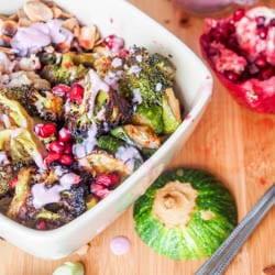 Super colorful and nutrient packed vegan wild rice green bowls with roasted broccoli, and zucchini, toasted almonds, pomegranate arils, and a vibrant pomegranate coconut sauce. Ultimate flavor combination. Easy to make and healthy. Perfect for dinner. Gluten Free too.
