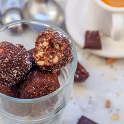 Vegan 5 Minute Chocolate Coconut Balls make for a perfect guilt free quick summer dessert. No baking required or clean up required - made in one pot. A handful of superfood ingredients including chia seeds, sunflower seeds and sesame seeds, along with dark chocolate, dates and peanuts make a perfect healthy sweet treat. Refined sugar free and gluten-free. | avocadopesto.com