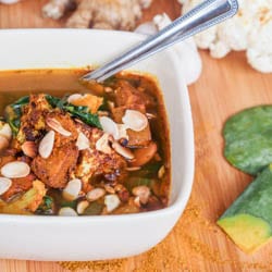 A 45 minute super comforting and hearty vegan curried paprika roasted pumpkin and cauliflower soup with spinach and almonds. Healthy and delicious. Gluten Free too. | avocadopesto.com