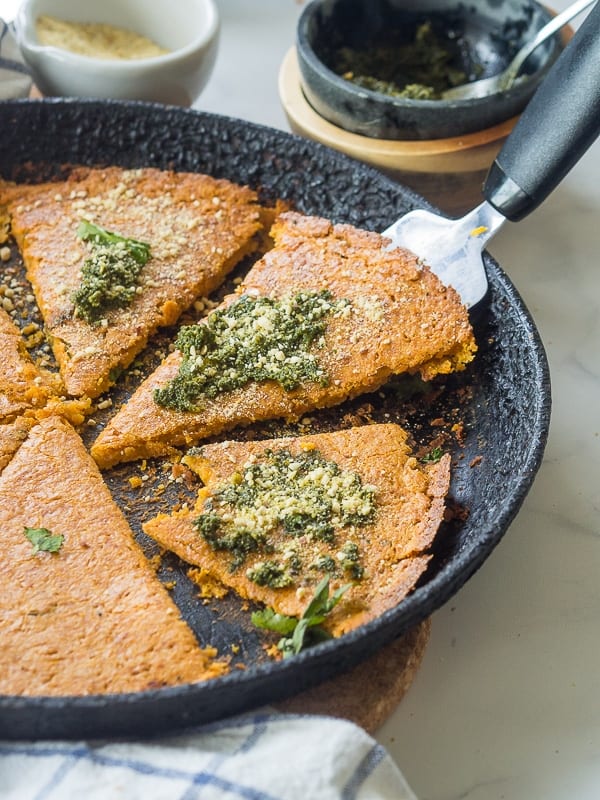 Chickpea Flatbread sliced in a cast iron pan