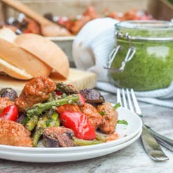 5 ingredients - pesto, chicken sausage, asparagus, red peppers and mushrooms is all you need for this simple and healthy chicken sheet pan dinner recipe that makes for the ultimate low fuss weeknight dinner. Gluten Free + Dairy Free too. | avocadopesto.com