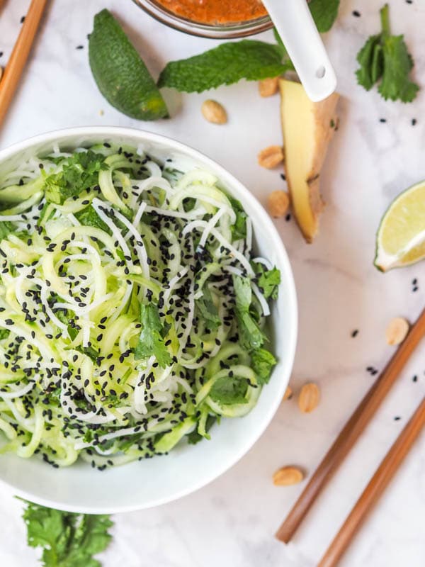 asian noodle salad without dressing, with rice noodles, spiralized cucumbers and herbs
