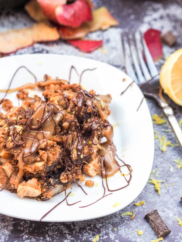 plated Gluten Free Apple Crisp with Walnut Graham Topping and drizzled with melted chocolate