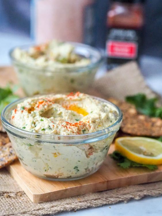 vegan cream cheese in a bowl served with crackers 