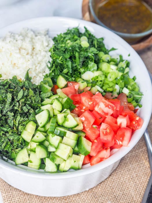 tabouli ingredients before mixing in the bowl 