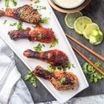 Korean chicken drumsticks are marinated in a spicy ginger sauce before being baked and dipped into a kimchi aioli. The most epic Korean themed low carb dinner! Gluten-Free & Dairy Free too.